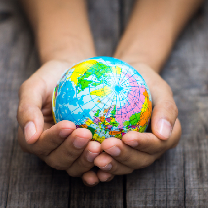 World globe in the palm of someone's hands