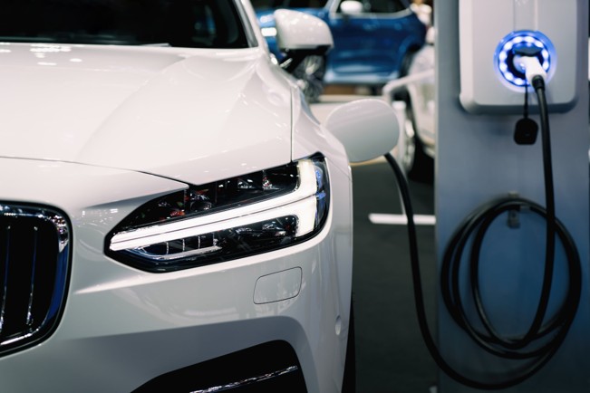 White car being charged