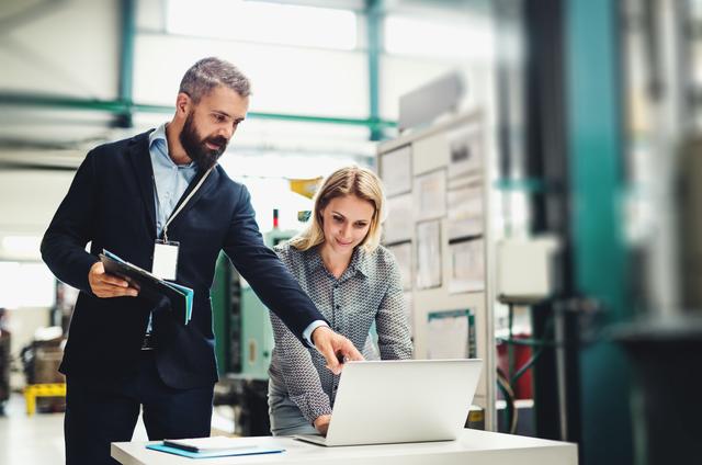people in front of the laptop using product selector on line 