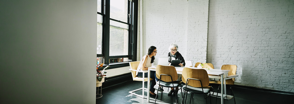 An image showing a couple of people discussing how to resolve a disputed invoice