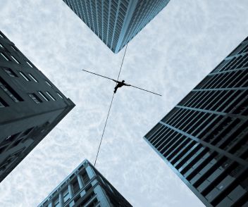 An acrobat between buildings