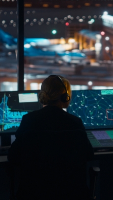 Air traffic control officers looking at a screen