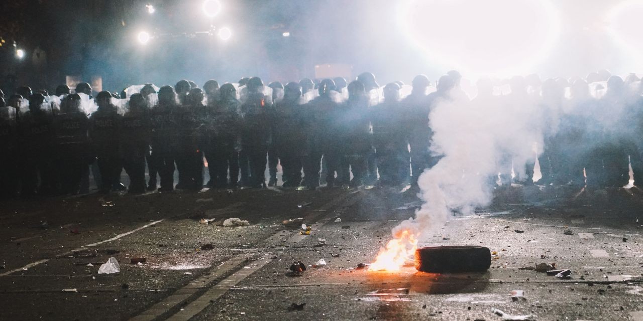 Photo of a police barricade in a riot