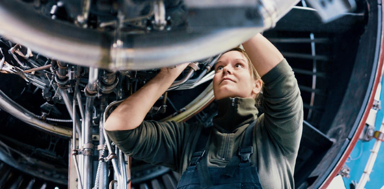 Engineer working on an aeroplane engine