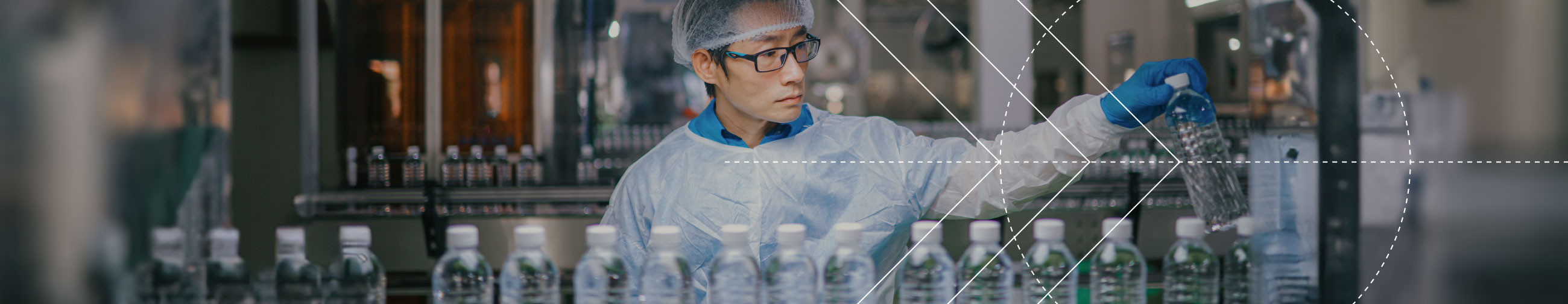 Worker on a medical assembly line, carrying out quality control on products