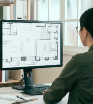 Imagen de un profesional haciendo arquitectura en su ordenador